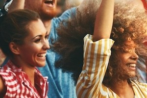 Two women dancing at a concert