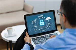 man looking at laptop